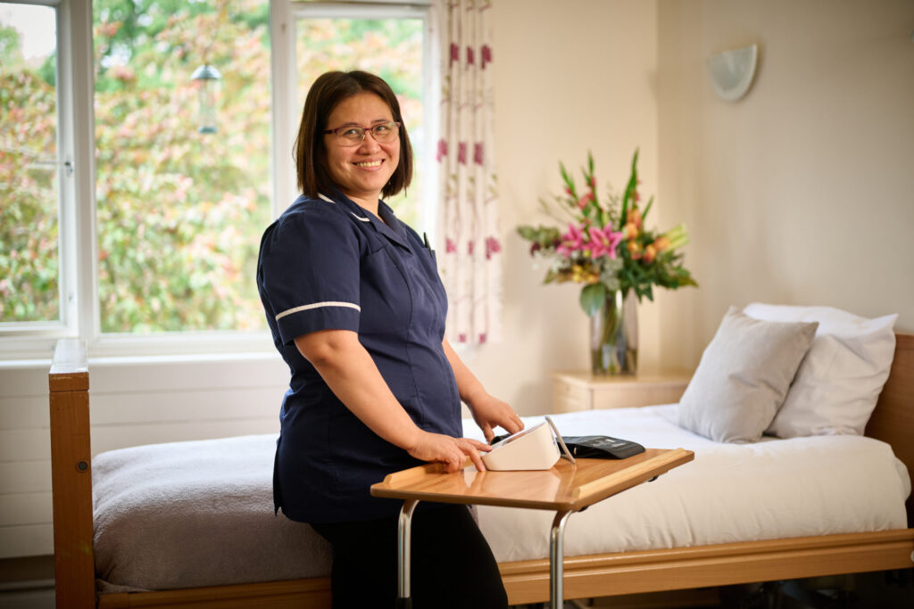 nurse in care home bedroom